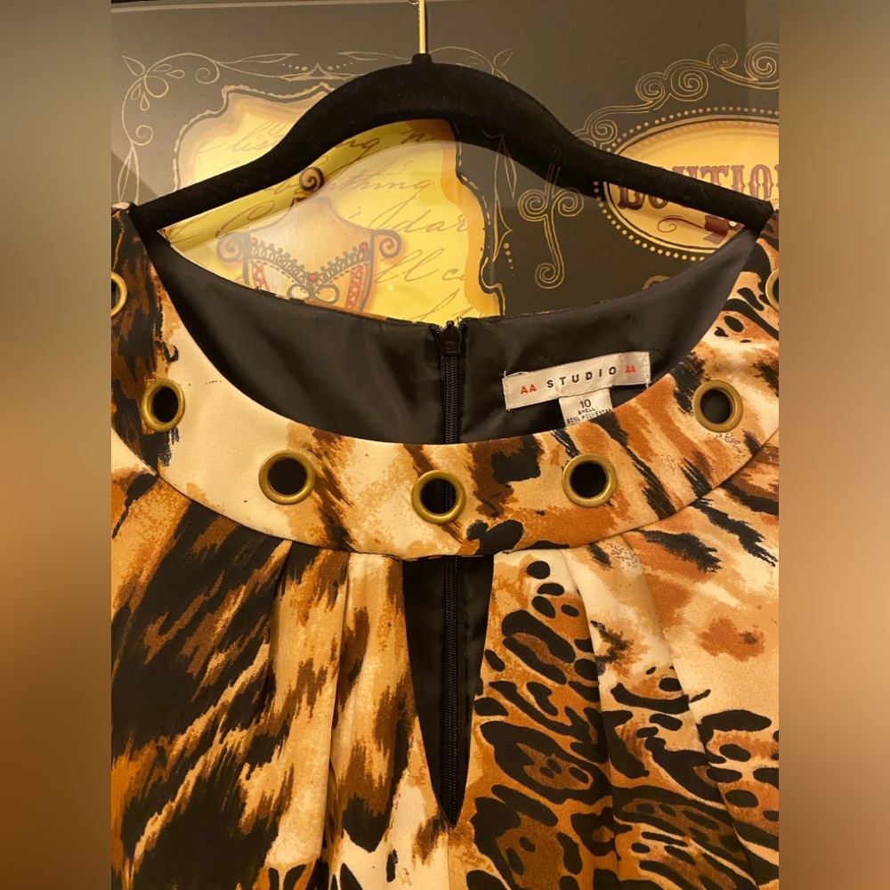 Animal print dress with gold grommets around neckline. Size 10, back zipper. NWT - Picture 2 of 4